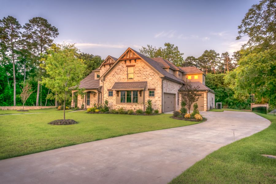 Suburban home with maintained lawn and landscaping